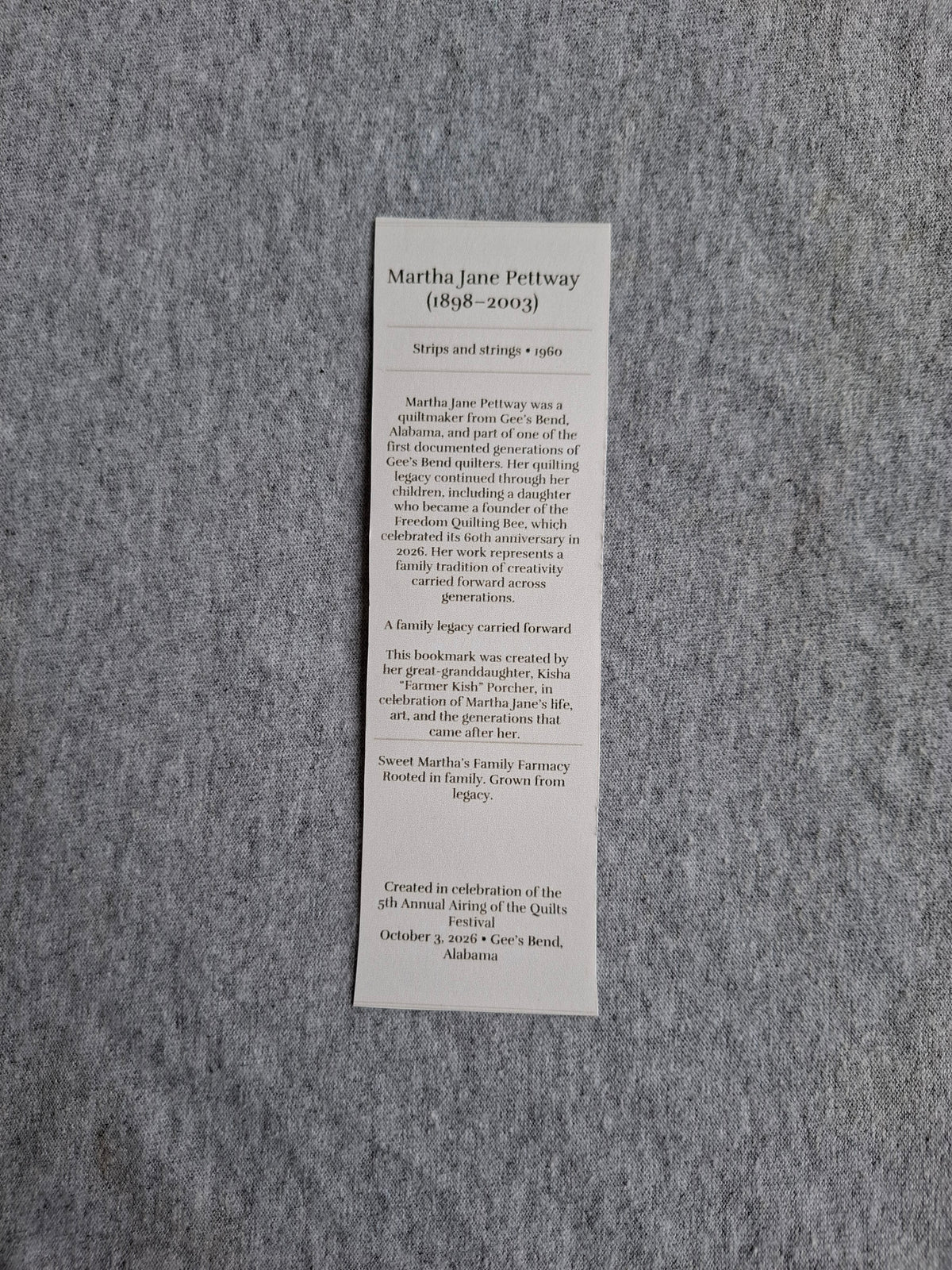 Back of Grandma Martha Jane Pettway's Strips and Strings (1960) heritage bookmark featuring her biography and quilting legacy.